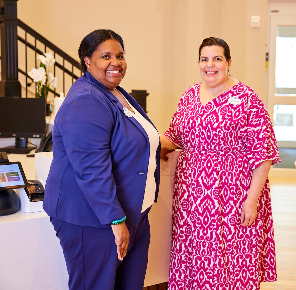 Team members at front desk - crop