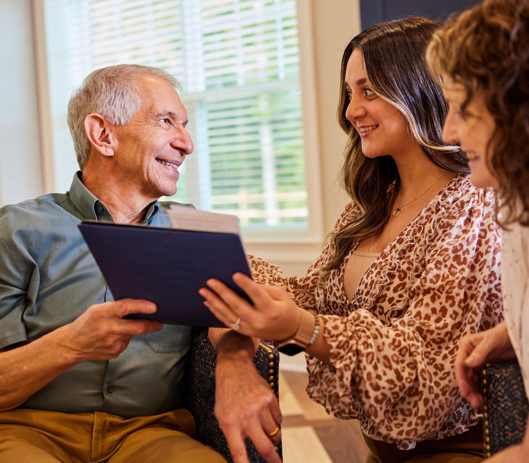 Arbor team member gives a potential resident and his daughter community information